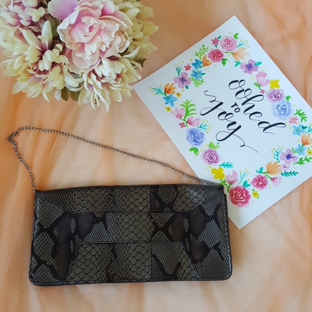 Daisy Fuentes snake skin clutch
